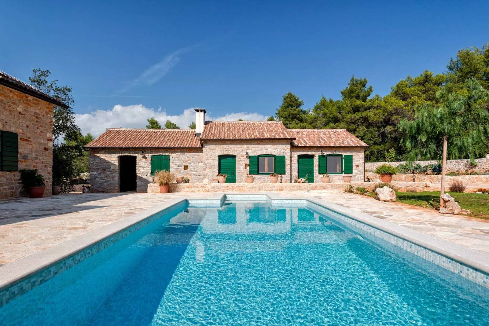 Villa Iris with rustic charm and a stone courtyard, ideal for an outdoor wedding.